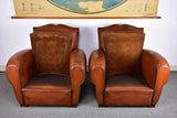 Pair of moustache back French leather club chairs