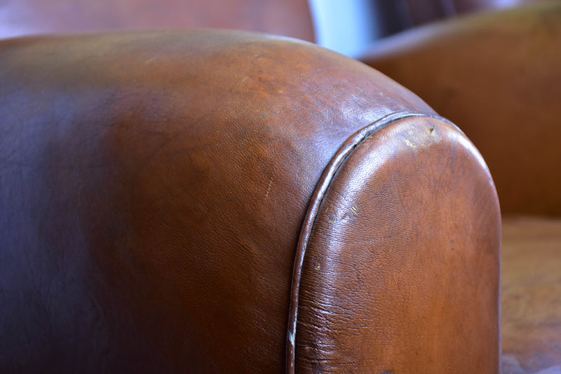 Pair of moustache back French leather club chairs