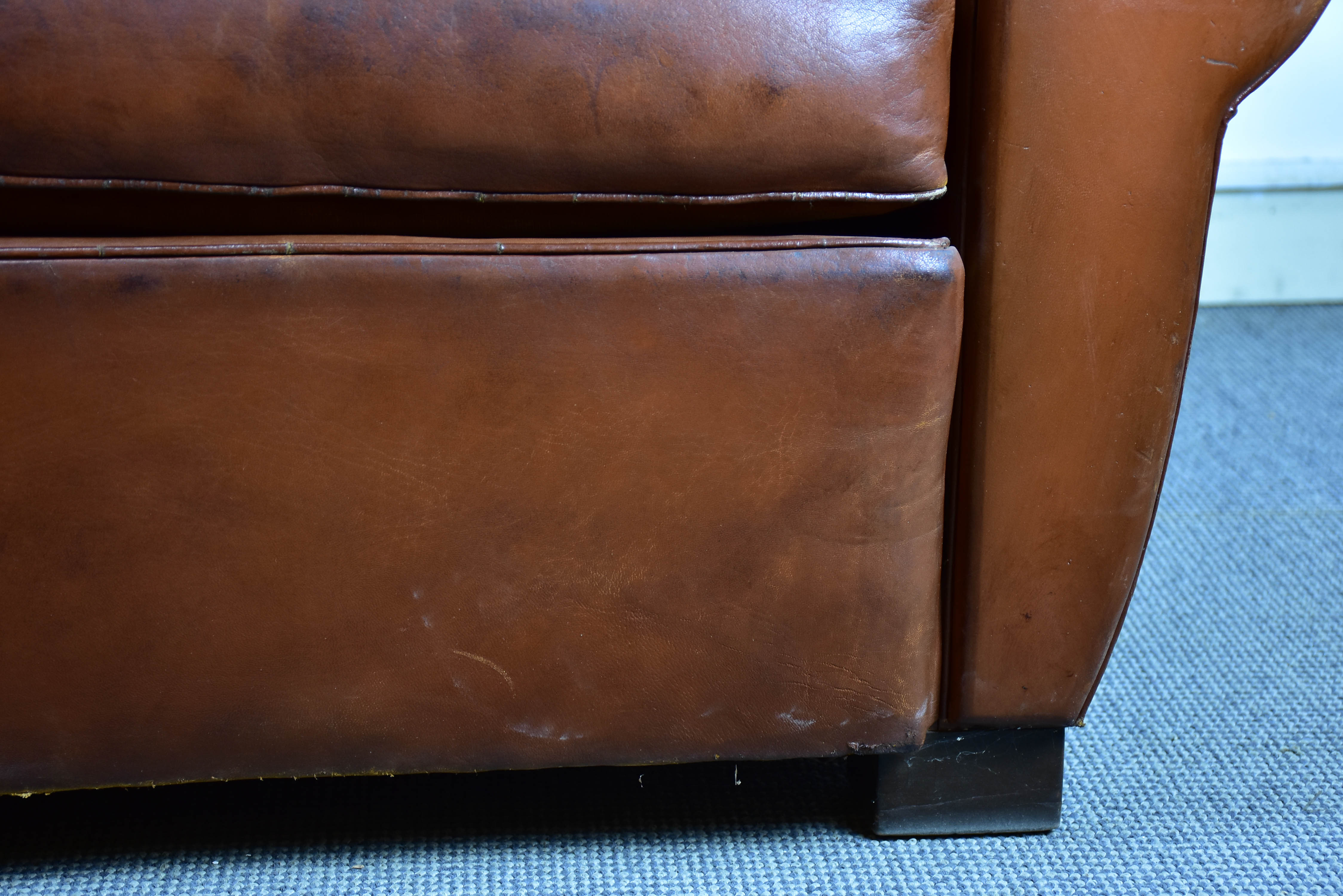 Pair of moustache back French leather club chairs