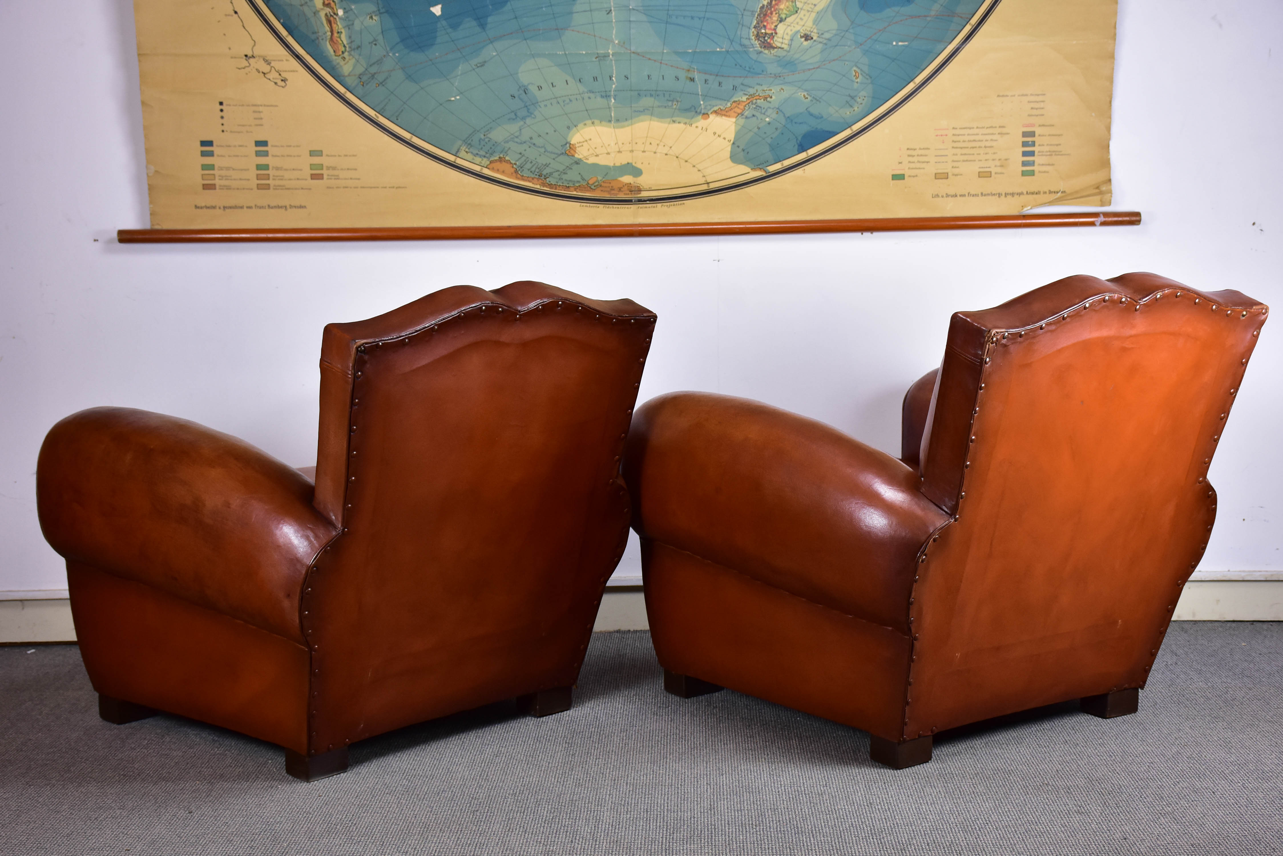 Pair of moustache back French leather club chairs