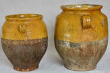Two large antique French confit pots with yellow glaze