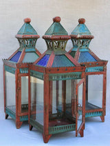 Three large lanterns with colored glass