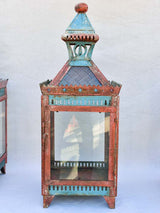 Three large lanterns with colored glass