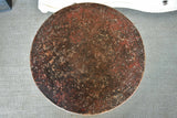 Round French garden table with red patina