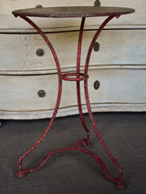 Round French garden table with red patina