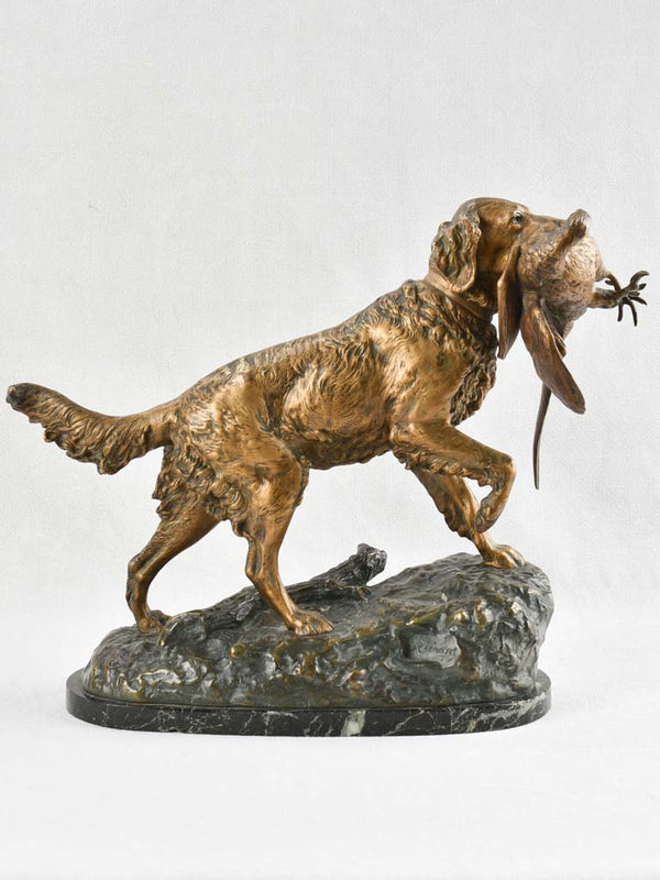 Bronze sculpture of a hunting dog with bird in mouth - late nineteenth century 15¾"
