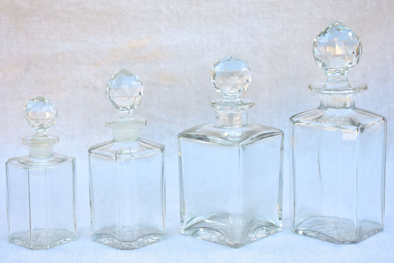 Four 1920's Baccarat perfume flasks