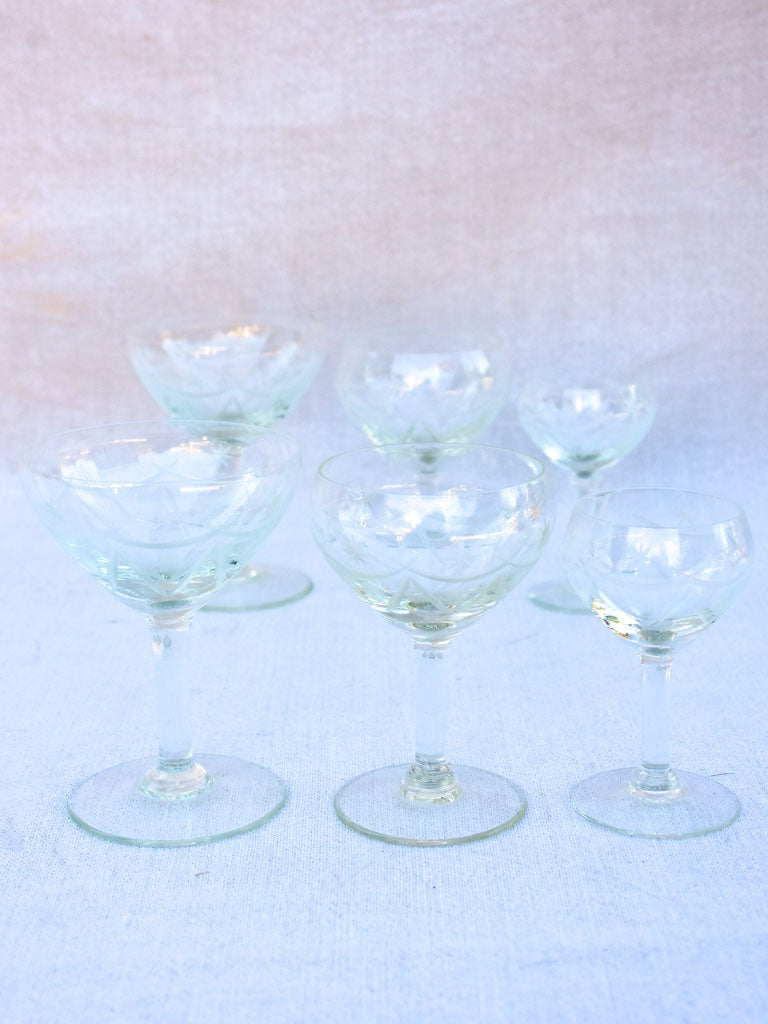 Set of antique French crystal wine and digestif glasses with pretty engravings