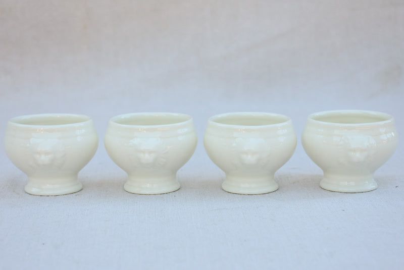 Four miniature earthenware cream bowls