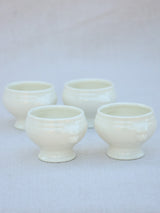 Four miniature earthenware cream bowls