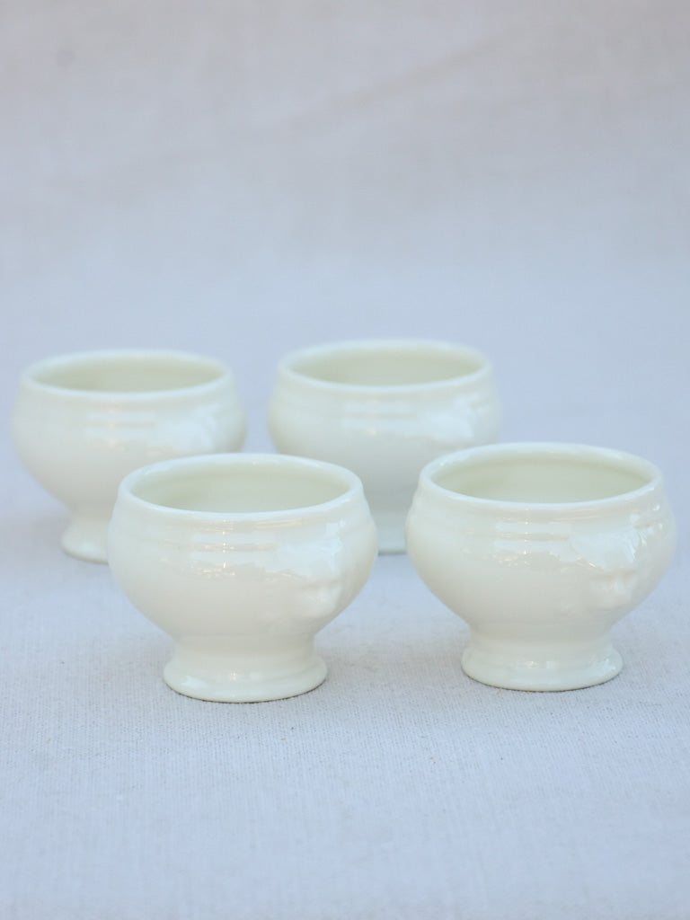 Four miniature earthenware cream bowls