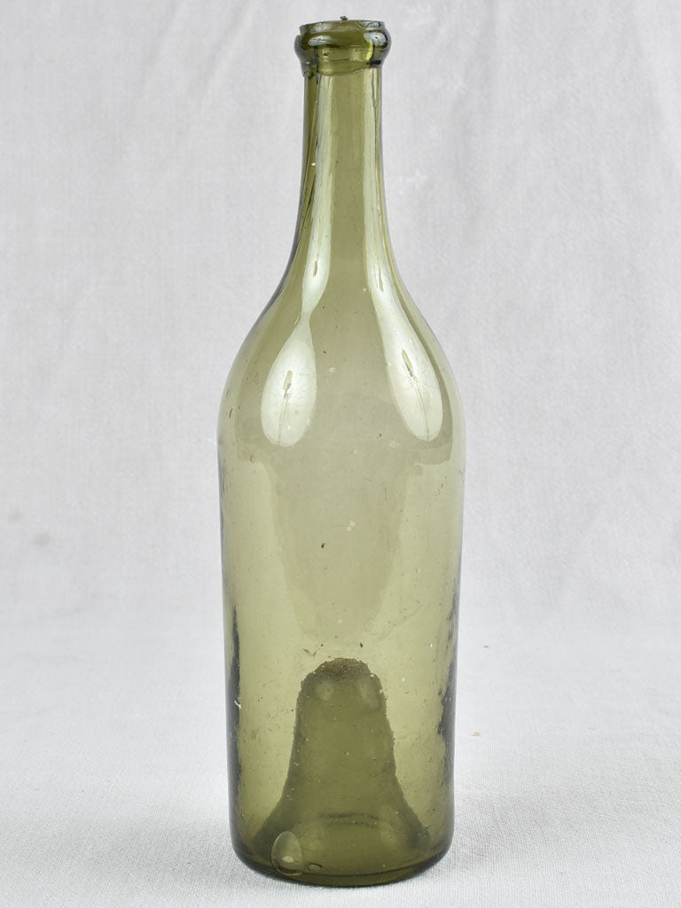 Olive glass 19th-century wine bottle