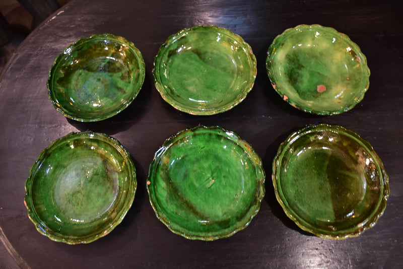 Set of six green glazed Provencal earthenware plates