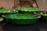 Set of six green glazed Provencal earthenware plates