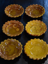 Set of six yellow glazed Provencal earthenware sauce bowls
