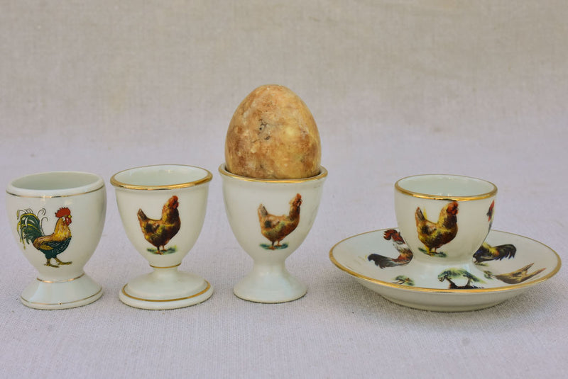 Four 1920's French porcelain egg cups with chicken and rooster transfers