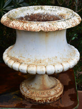 Two large antique French garden urns with white finish
