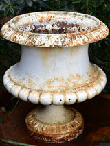Two large antique French garden urns with white finish