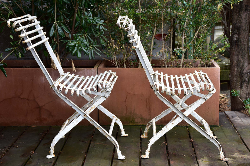 Pair of antique French folding Arras garden chairs with claw feet