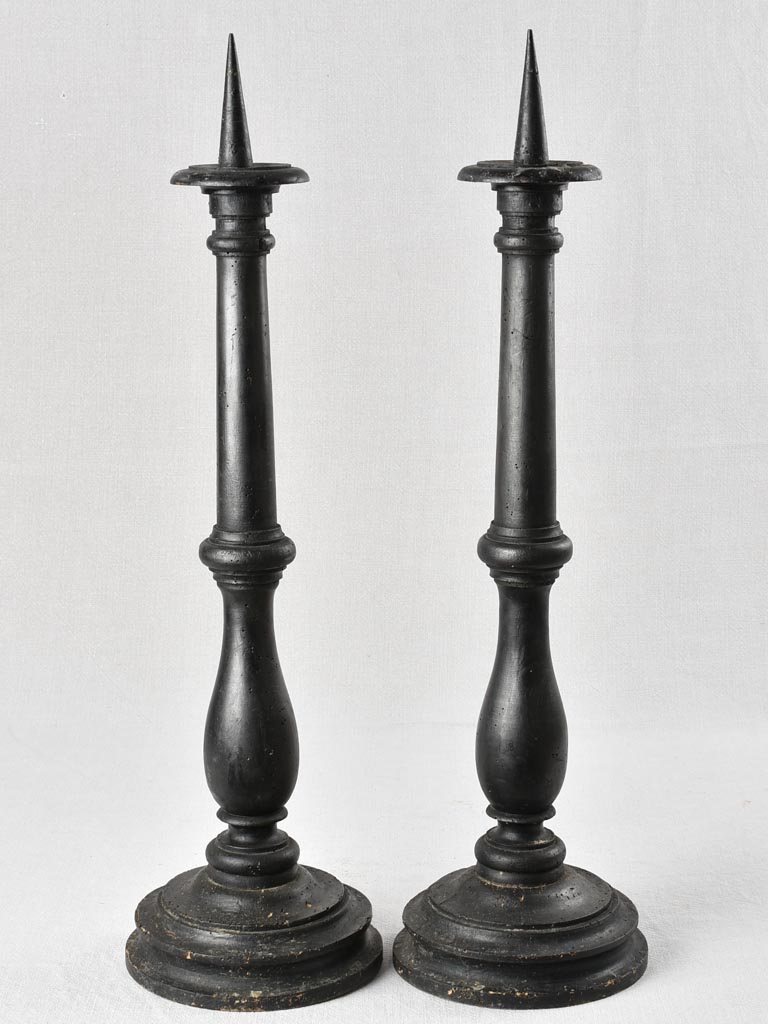 Pair of large antique candlesticks with black paint finish 27½"