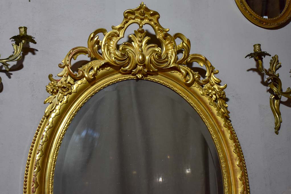 Very large oval French mirror with gilded frame and crest 32¼" x 48½"