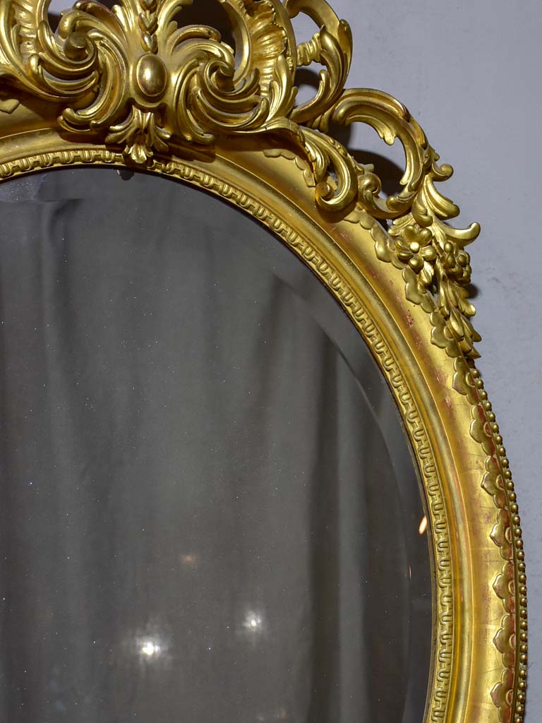 Very large oval French mirror with gilded frame and crest 32¼" x 48½"
