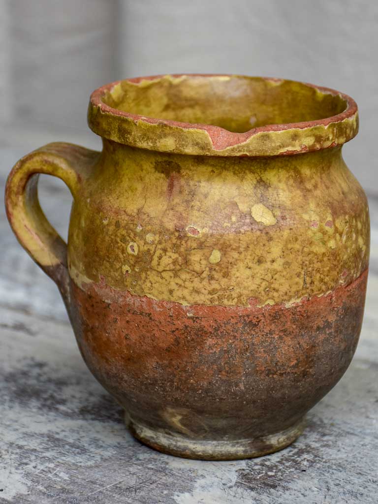 Antique French cup with yellow glaze