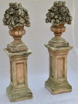 Pair of French concrete columns with fruit baskets 51"