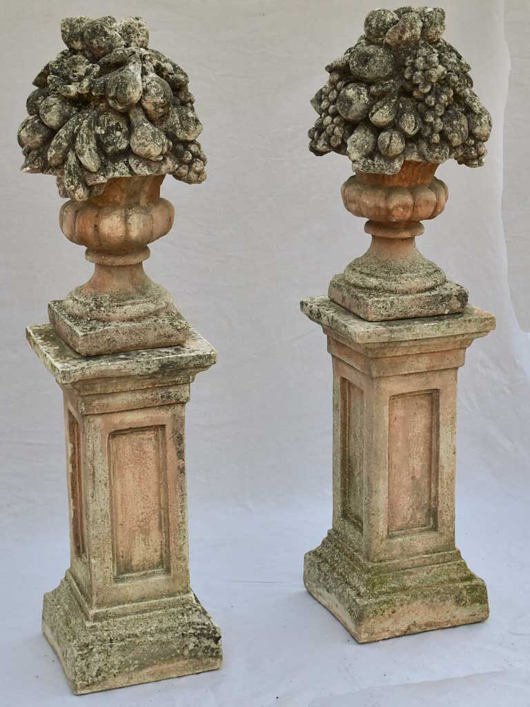 Pair of French concrete columns with fruit baskets 51"