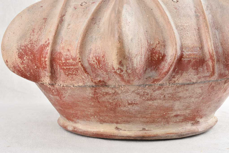 Old sculptural terracotta vase