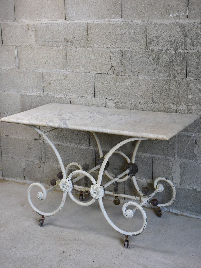 Antique French marble butcher's table with cast iron stand on wheels