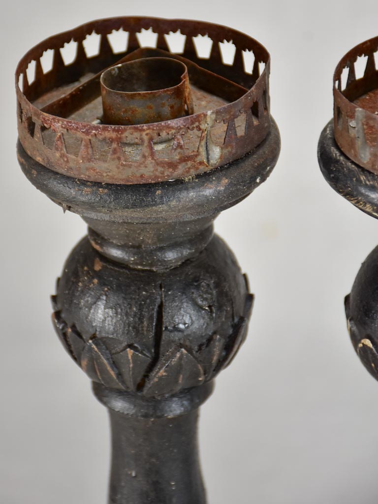 Three twentieth-century French wooden candlesticks with black paint finish 15"