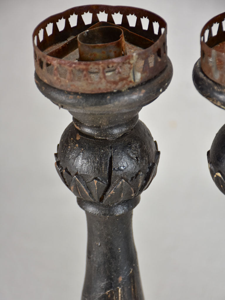 Three twentieth-century French wooden candlesticks with black paint finish 15"