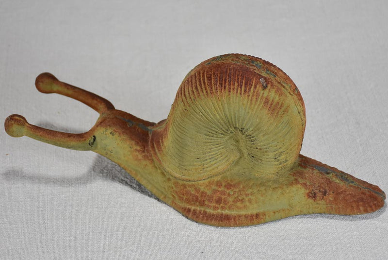 Vintage cast iron duck and oversized snail