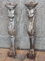 Two console table legs with lion heads and claw feet