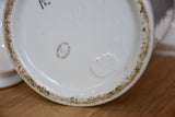 Set of seven French porcelain apothecary jars