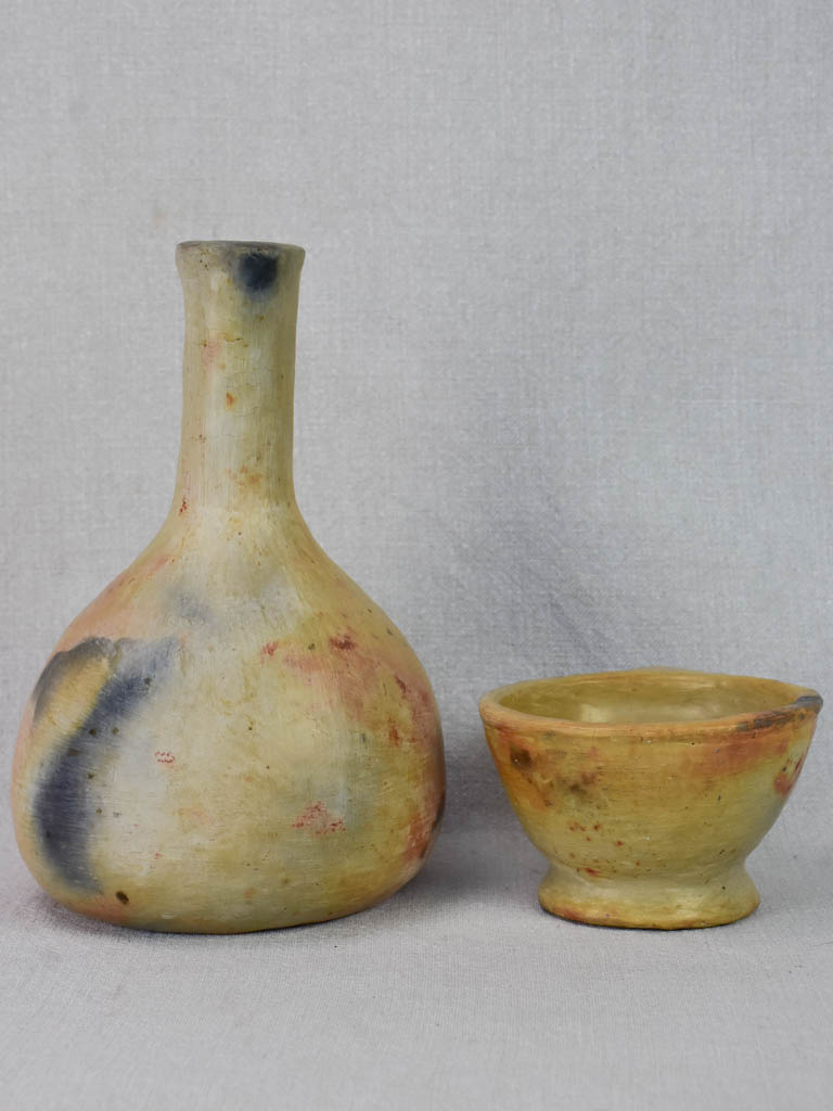Two artisan-made ceramics made from wood-fired clay - vase and cup
