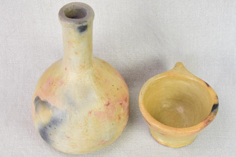 Two artisan-made ceramics made from wood-fired clay - vase and cup