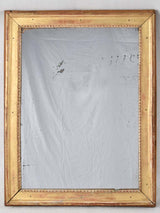 Gilded Louis XVI mirror with running pearl and mercury glass 28" x 20¾"