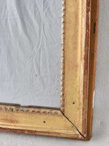 Gilded Louis XVI mirror with running pearl and mercury glass 28" x 20¾"