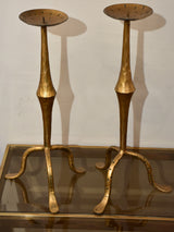 Pair of vintage gold candlesticks with a tripod stand