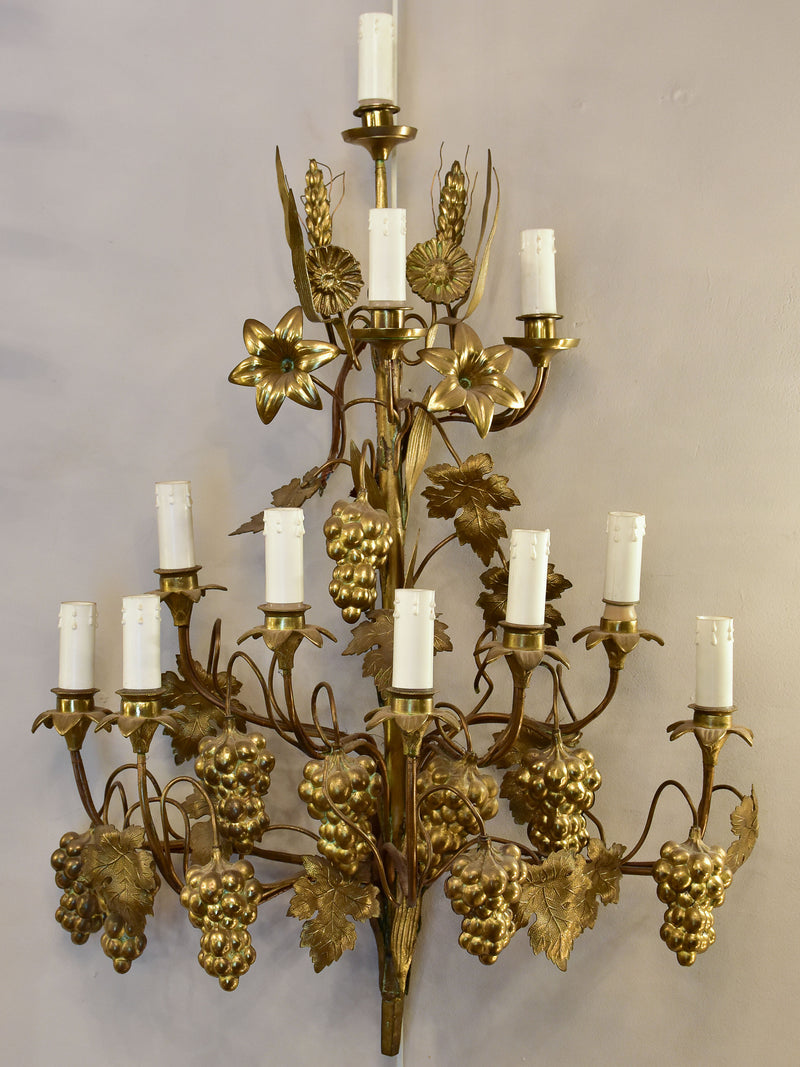 Large pair of gold wall sconces with grapes and vine leaves