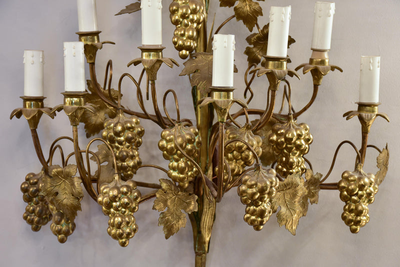 Large pair of gold wall sconces with grapes and vine leaves