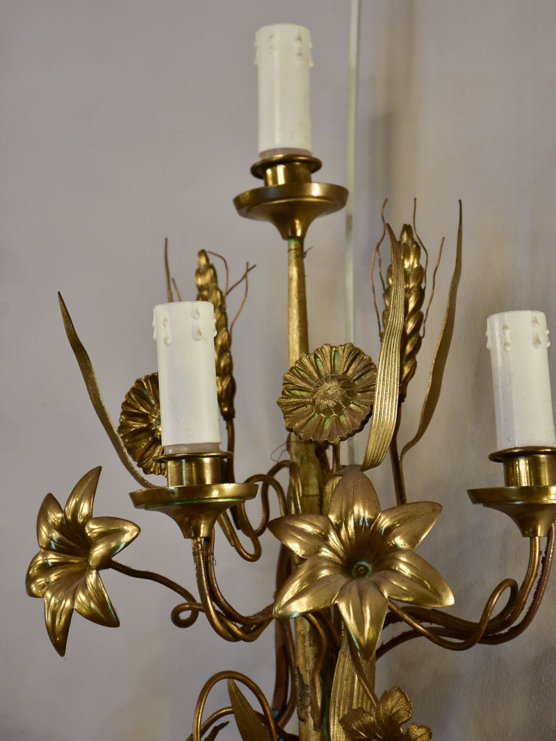 Large pair of gold wall sconces with grapes and vine leaves