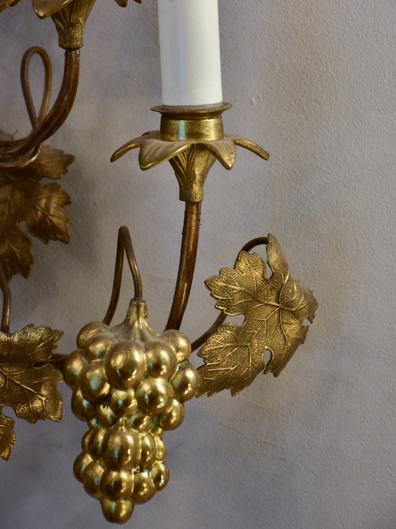 Large pair of gold wall sconces with grapes and vine leaves