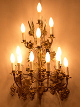 Large pair of gold wall sconces with grapes and vine leaves