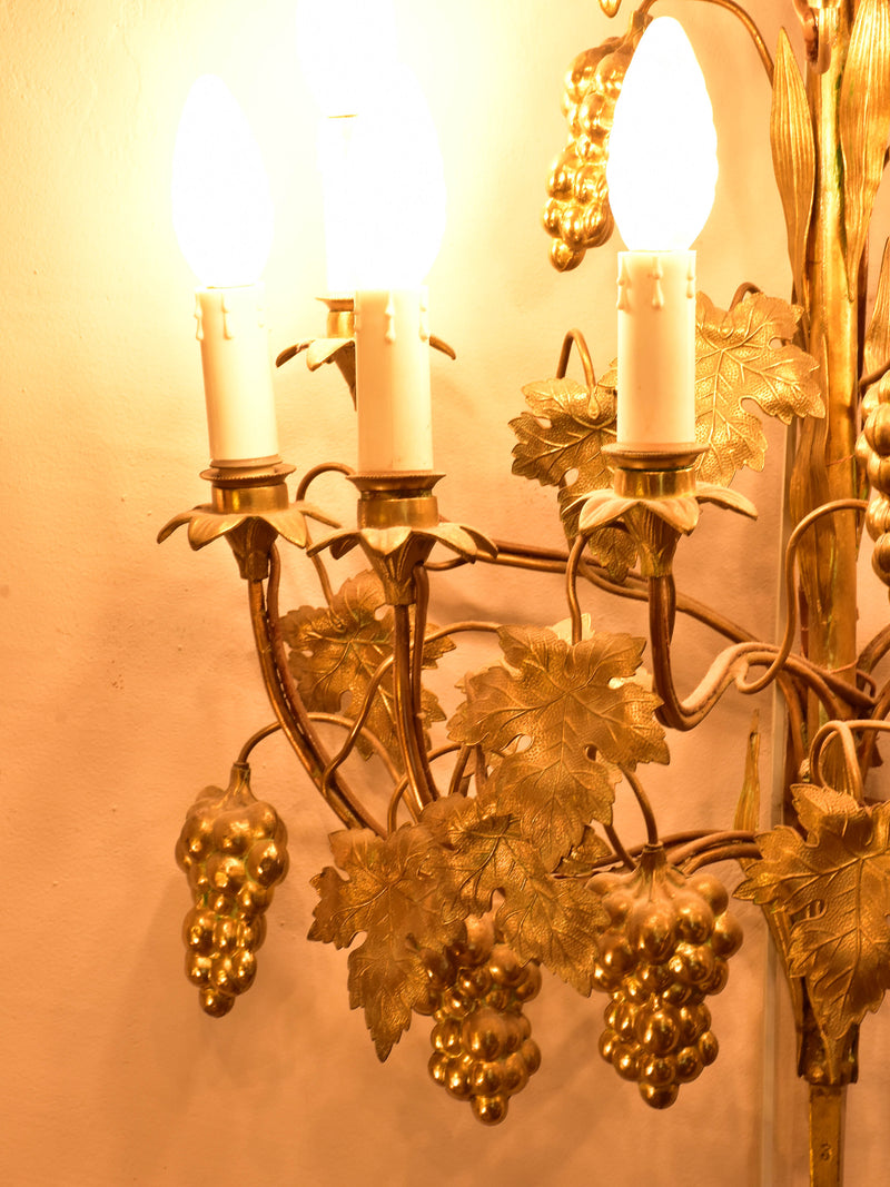Large pair of gold wall sconces with grapes and vine leaves