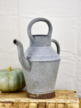 Antique French watering can with two handles