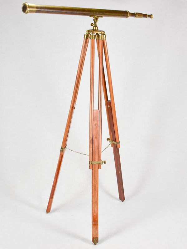 Vintage telescope on wooden tripod