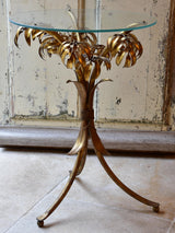 Small round Hans Kögl table with gold palm frond stand